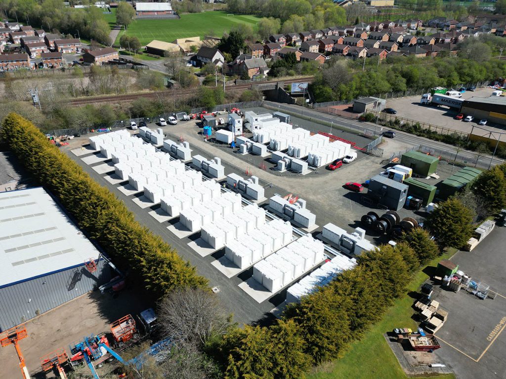 Aerial view of Zenobē’s battery storage site in Wishaw, showcasing rows of battery units designed to support grid stability and renewable energy integration within the local energy network.