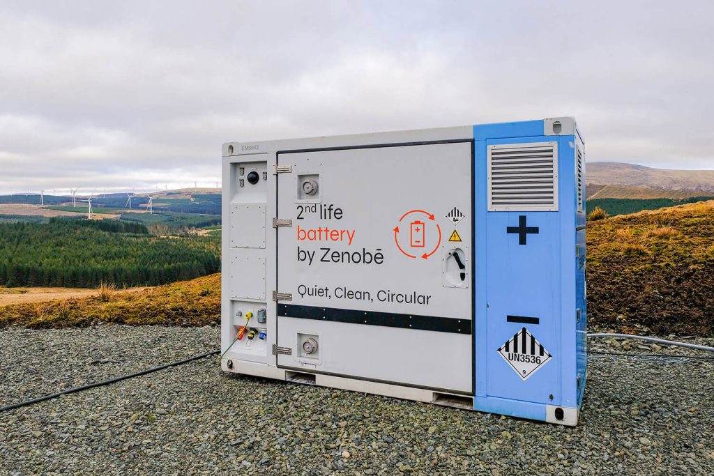 Zenobē second life battery with wind turbines in the background