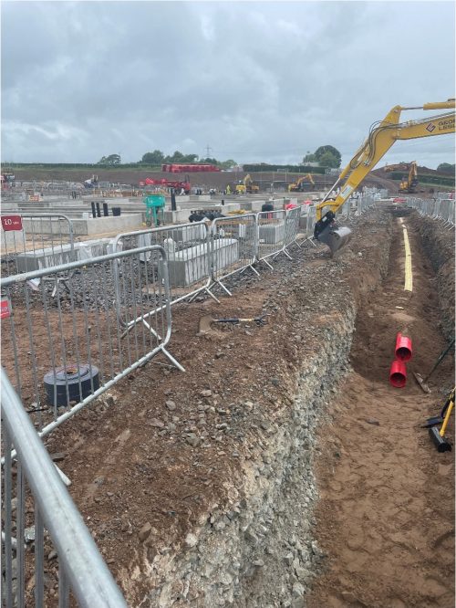 Open trench to install cable ducting