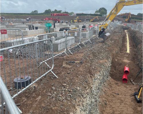 Open trench to install cable ducting